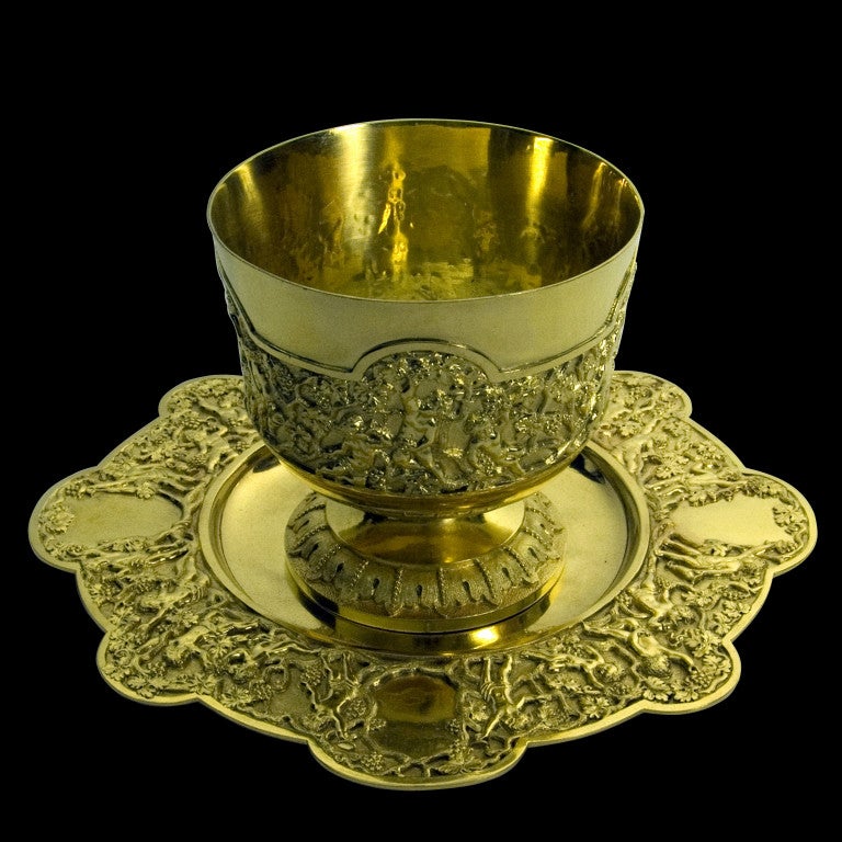 A very good Victorian silver gilt bowl & stand decorated with a cast silver-gilt applied Bacchanalian frieze border depicting Putti with grape and trailing vine in high relief.
