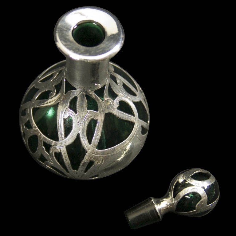 C19th Silver overlay green glass scent bottle with matching stopper with patent mark and marked as fine silver.
Signed: Patented G16 999/1000 FINE
