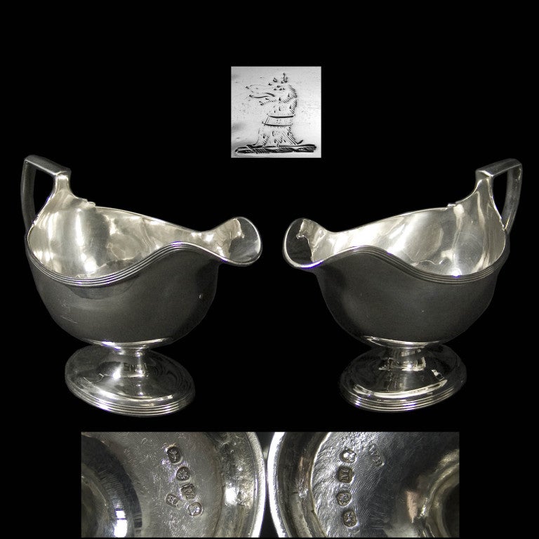A very good pair of plain pedestal sauce boats with decorative thread borders to rim and foot. Each piece engraved with original family crest.