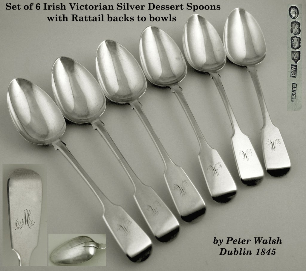 A set of six Irish silver Fiddle dessert spoons with rattail backs to bowls. 

Signed/Inscribed/Dated: Maker Peter Walsh Dublin 1845.