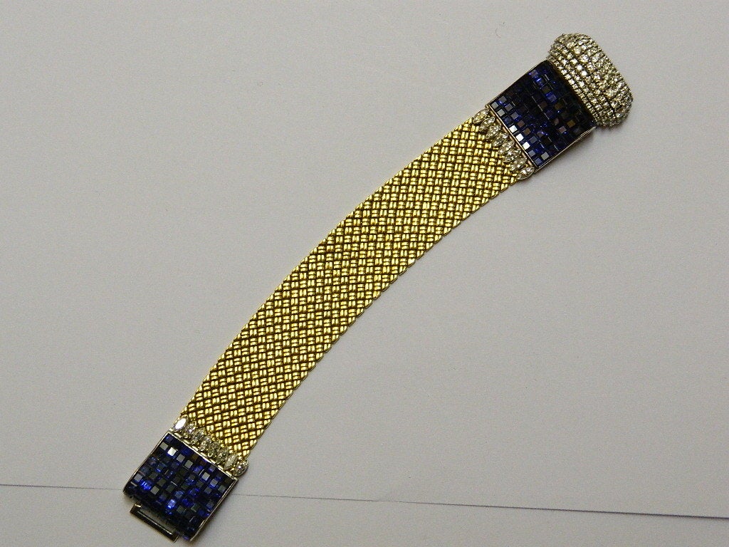 An extraordinary bracelet manufactured in France in the 1950s, presenting approx 5.00 cts of brilliant and marquise cut diamonds and approx 10.00 carats of sapphires, on 18kt yellow and white gold mountings. The sapphires are mounted according to