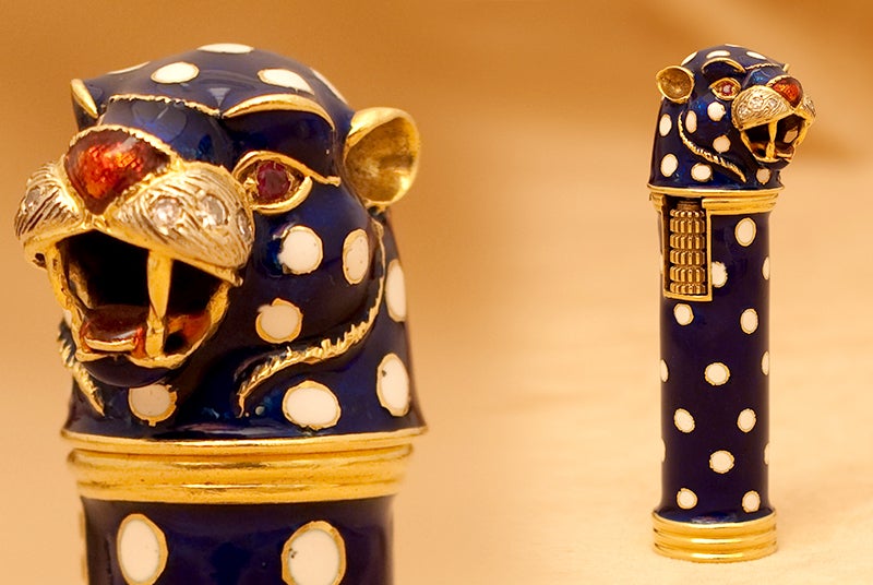 A sophisticated lighter, manufactured by the famous Italian designer Frascarolo during the 1970s, embellished by colourful enamel work and ruby eyes on an 18kt yellow gold mounting.