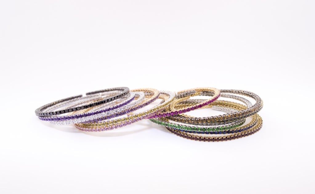 13 Bangle style Bracelets of 18K Gold, set with Diamonds, Sapphires, Rubies, Aquamarines, Tsavorites, Amethysts and Garnets.  Mix and Match!  55 Carats Total. Bracelets of spring gold, so very easy to put on, and very comfortable to wear!