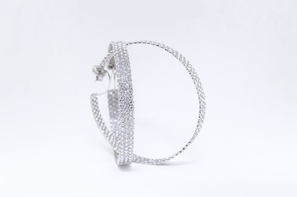 18K White Gold. 15 Carats.  The 450 Diamonds are set on the outside and inside of the piece.
