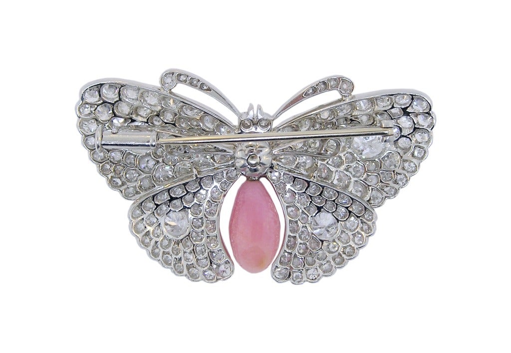Rare Belle Epoque Platinum Diamond and Conch Pearl Butterfly Brooch.  Circa 1900.  8 Carats of Diamonds (the center Antique Cushion Cut Diamond is about 1 Carat). Beautifully hand fabricated with complete back azuring. 2 inches wide and 1 inch tall.