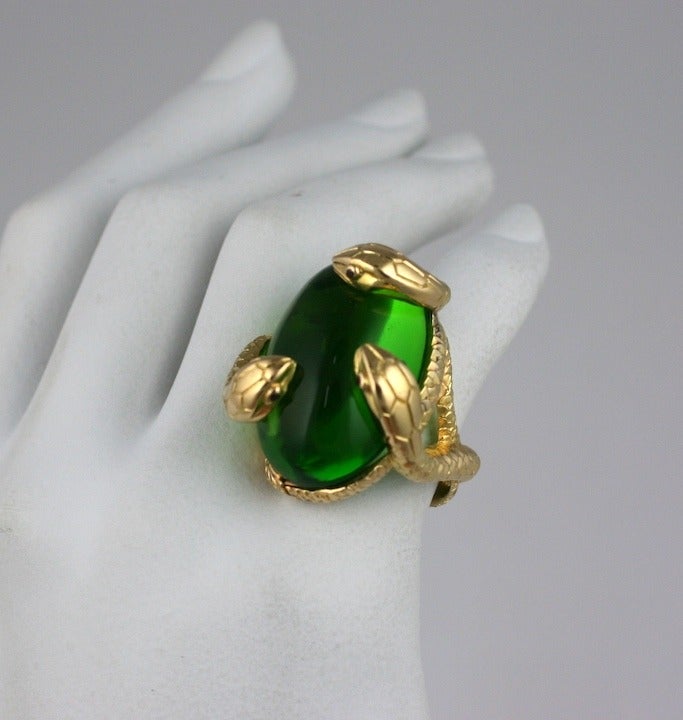 Oversized Italian cocktail ring in 18K gold with Pate de Verre glass. 3 finely detailed snakes are entwined around a large green pate de verre 