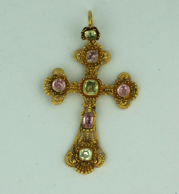 Elaborate cross from circa 1820s of fine gold cannetile work showcasing cushion cut,close backed pale pink morganites and pale green spinels in an elaborate framework of etruscan beadwork and 3D buttercups. Exceptional quality and condition.