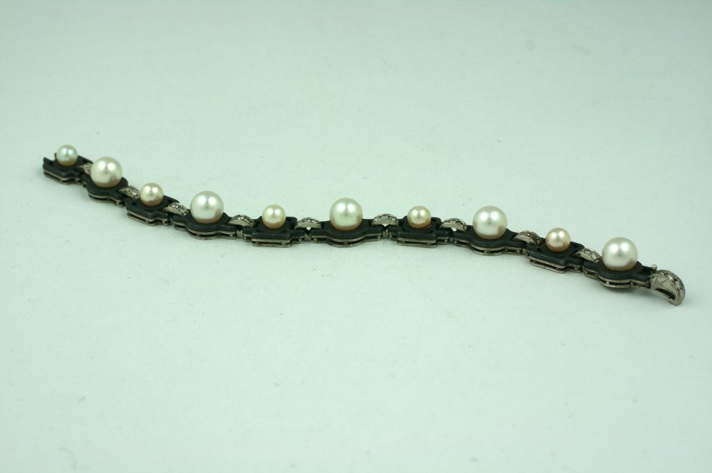 Unusual and rare bracelet from Marsh and Co, San Francisco. Signature mix of pearls, patinaed steel and diamonds set in 18K white gold. Dating from the 1930s-40s, these pieces were emblematic of the founder George T. Marsh's love for oriental art