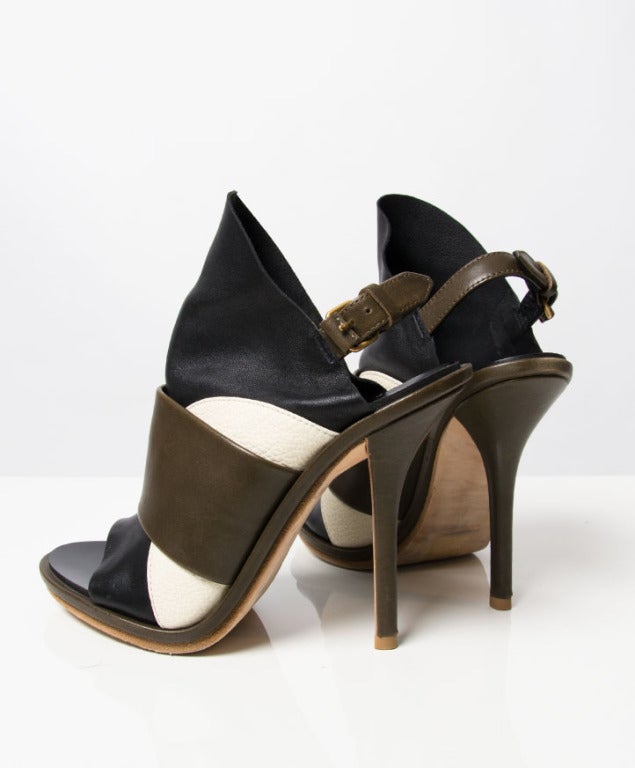 Balenciaga Black, Brown and White Glove Leather Slingback Sandals. These black leather shoes have an open toe and a high front panel featuring a Brown and white leather overlay panel and a brown slingback strap with a side buckle fastening. The