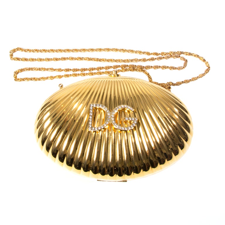 Dolce & Gabbana metal shell clutch with embellished logo