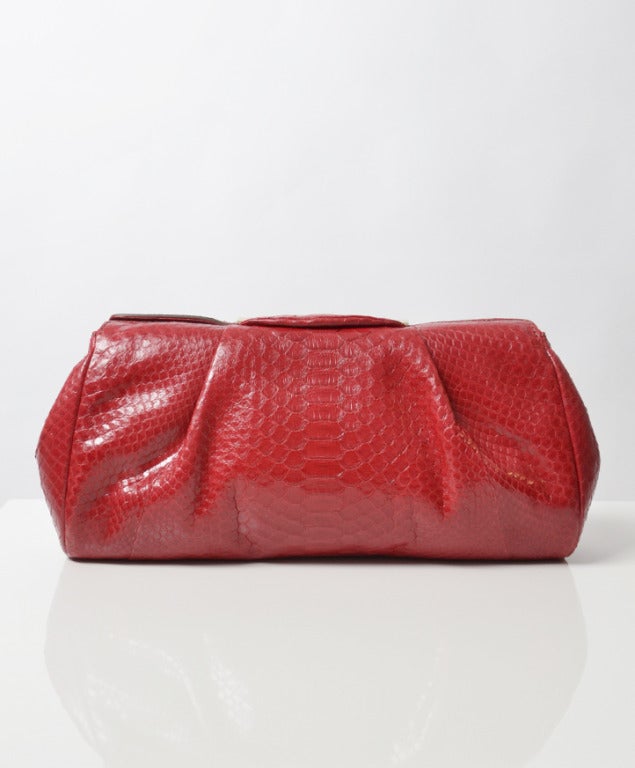 Ultra-luxe python clutch from Zagliani
Classic rectangle shape with gathering, metallic hardware, snap closure, internal zip pocket and slip pocket
Comes with dustbag. 
Retail price € 2030.

Dimensions: 
H19cm x W35cm x 9,5cm
