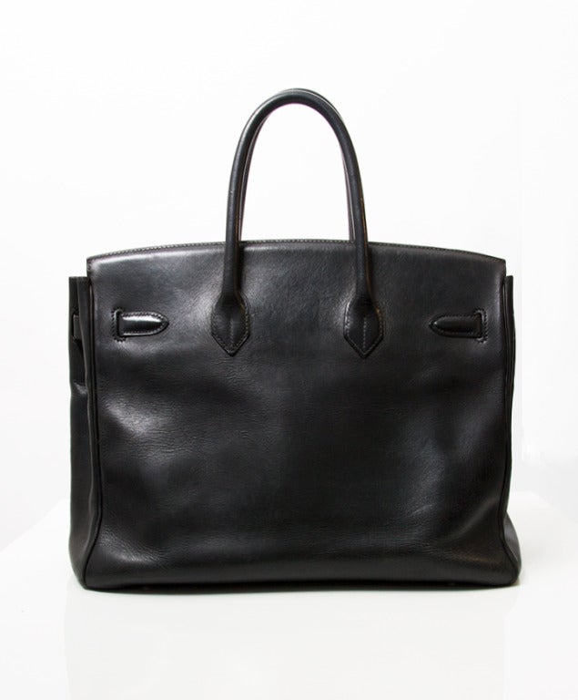 Authentic black Birkin handbag with silver hardware. 

Blind stamp = 'C' in a square/ fabricated in 1999.