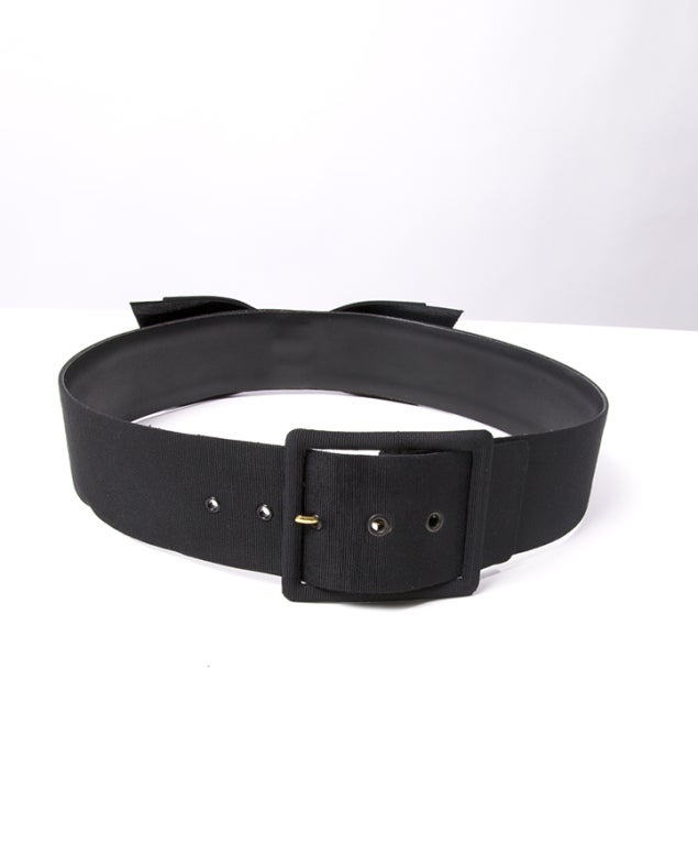 Chanel belt in black with big bow on the front with fabric and leather on the inside.
