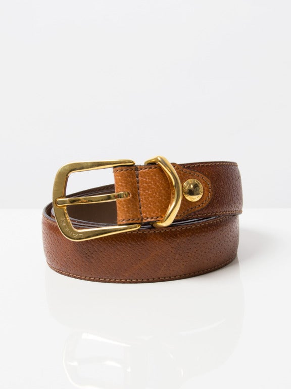 Lancel tan genuine leather belt with gold hardware. Five belt holes. Comes with the original dust bag and box.

Size 105/42