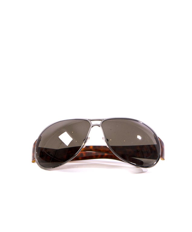 Prada sunglasses with gray glass and chrome metallic frame and tortoise shell stems.