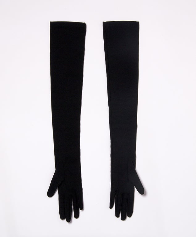 Long Evening or 'Opera' gloves by Dolce & Gabbana in black crepe de chine silk. Featuring burgundy flower embroideries. Each flower - 2 per glove - has a red crystal in its heart. 

Fits small
L: 60 cm