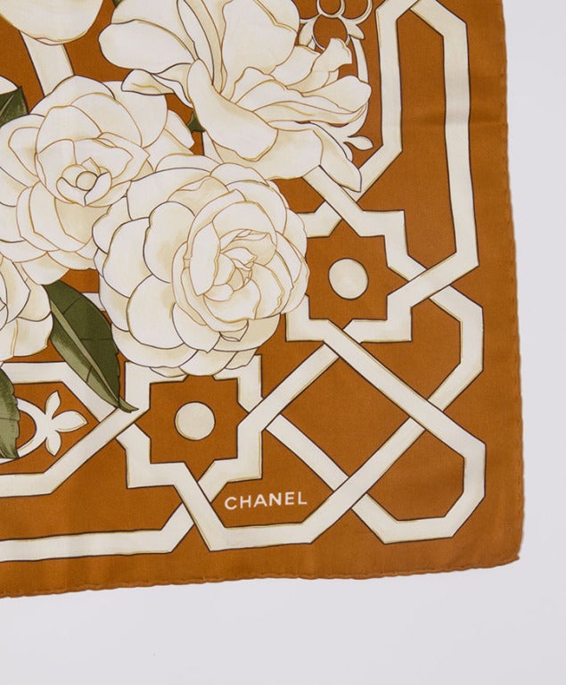 Chanel Silk scarf in cognac and cream hue depicting blooming roses. 

95cm x 97cm