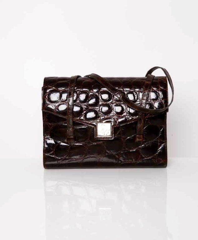 This authentic Dior vintage bag is made of a beautiful brown croco. 
With this handbag you will definitely make a statement: elegance and style are truly timeless. The two handles are made of croco as well and make it possible to wear the handbag