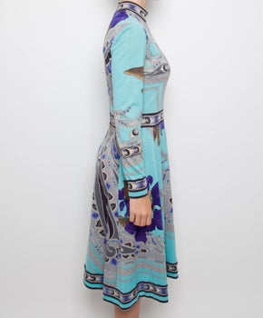 Leonard is known for its devastatingly gorgeous prints in silk & wool jersey. The patterns are typically flower prints and the colors are rich and sumptuous. 
Blue floral inspired print, small round turtle neck, thin belt in same fabric and print,