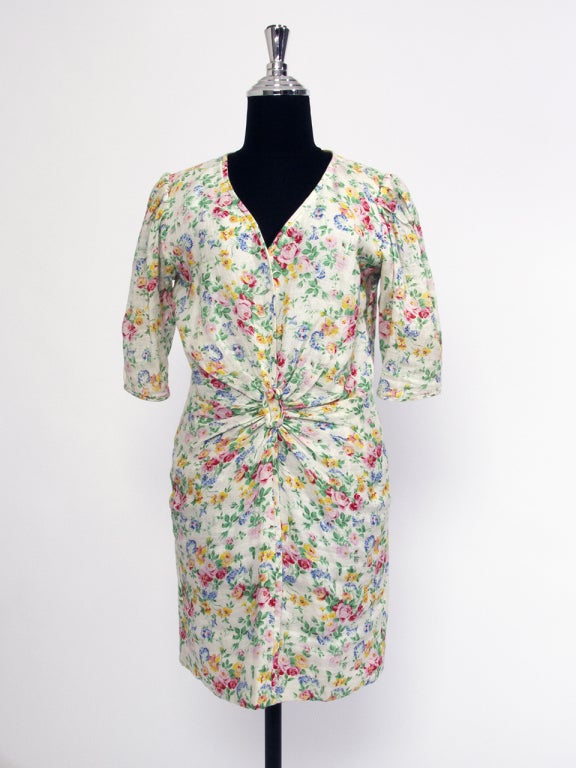 Ungaro dresses are known for their flamboyant patterns and elegant draping with an emphasis on the comfortable and flattering encasement of the female form. These dresses are truly vintage pieces. 
100% white linen dress with flower print, perfect