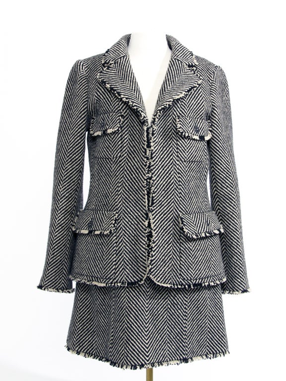 Vintage Chanel skirt suit in black & off-white striped wool. The suit consists of a blazer vest and matching skirt.