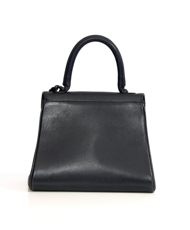 Delvaux Brillant in anthracite matte leather with gold hardware details.
Stain of nail polish on the interior.