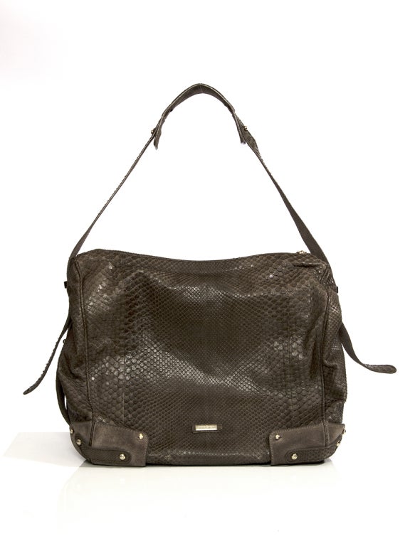 Giorgio Armani snakeskin handbag in dark brown.
Supple feel in a casual shape.