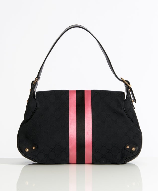 Gucci Guccisima Horsebit Black Pink Stripe Flap Bag. Signature Gucci shoulder bag with ajustable shoulder strap. The bag is made from black fabric with embroidered Gucci logo pattern featuring a pink and black satin stripe in the middle. 

33cm x