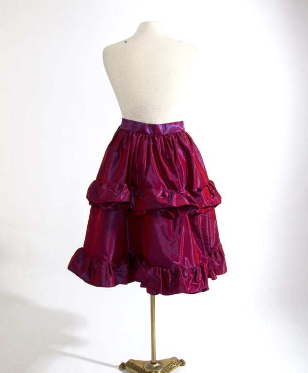 A unique Givenchy couture piece: 
A-line frock in puffy taffeta silk in raspberry hue with blue shine. 
True red carpet material and a wonderful contemporary alternative to your usual cocktail dress! Wear with a simple black top and a cross body