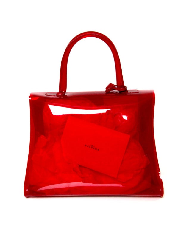 Rare new collector's item: Delvaux Brillant MM Chaperon Rouge edition. 

On the occasion of the 1958 Brussels World Fair, Delvaux created a stir with the launch of a new handbag: the Brillant. Created by designer Paule Goethals, this design
