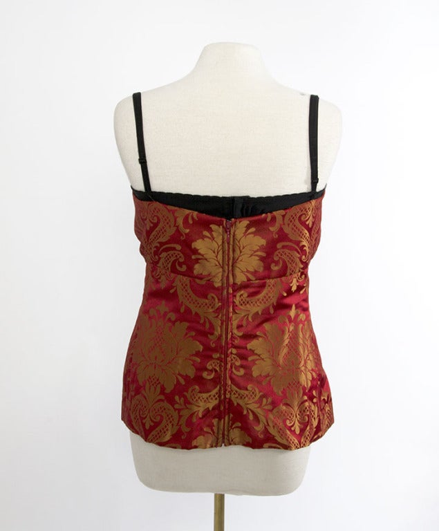 Silk corset top by Dolce & Gabbana in red and gold with lace lingerie lining.