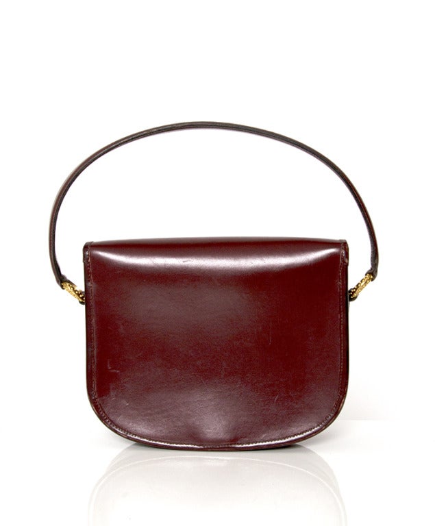 Rare Hermes edition: handbag with evelyn shoulder strap in luxurious burgundy hue made from smoothest boxcalf leather. Features a gold golf ball with 'Hermes Paris' engraving.

24cm x 20cm x 7cm 
9,5
