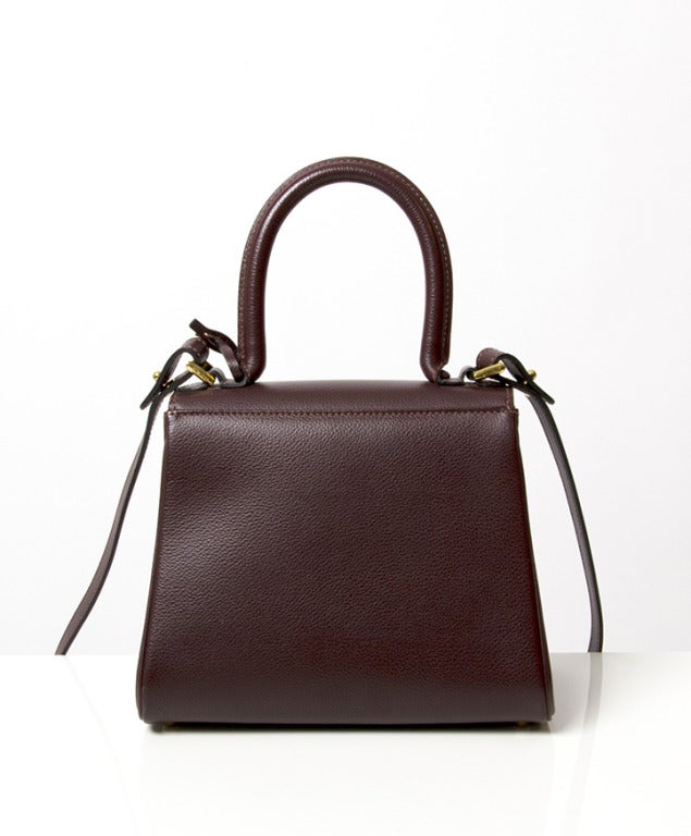 Grained Sellier leather flap front handbag with faux-gusseted body, rolled leather top handle and distinctive 