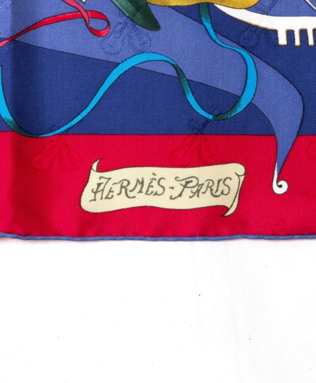Lovely Hermes scarf made from 100% silk, named 'Le Carnaval de Venise' in Renaissance colors like royal blue, forest green and apple red. Smalle duos of mandolins are woven into the silk base, watermark style.