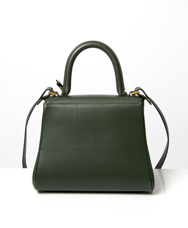 Super cute and elegant petit Delvaux Brillant in green grained Sellier leather with flap front, rolled leather top handle and distinctive 