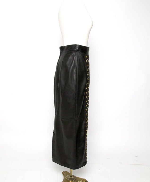 Maxi leather skirt by Versace. With faux corset lace-up embellishments. Gold hardware. 

Total length: 34,3