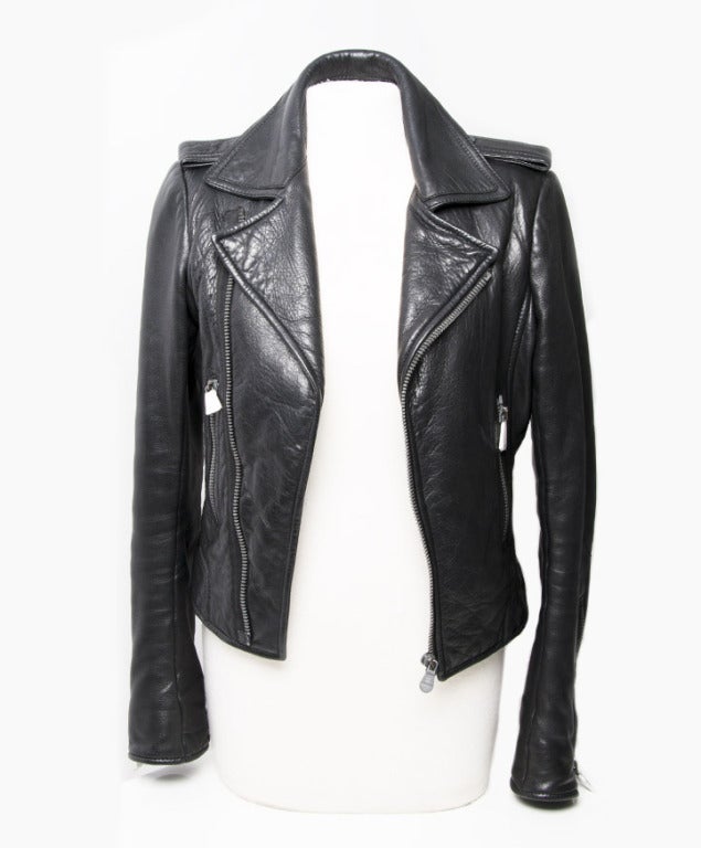 Balenciaga Leather Biker Jacket
Black 
With Collar
Zipper closure
Zip closure on each sleeve
100% Lambskin
Size: 38 EU