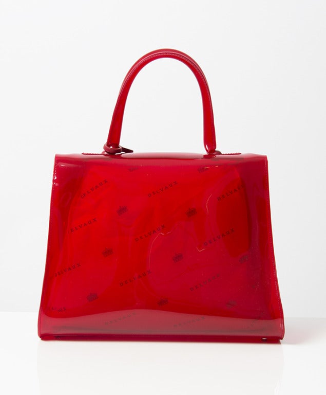 Rare new collector's item: Delvaux Brillant MM Chaperon Rouge edition. On the occasion of the 1958 Brussels World Fair, Delvaux created a stir with the launch of a new handbag: the Brillant. Created by designer Paule Goethals, this design quickly