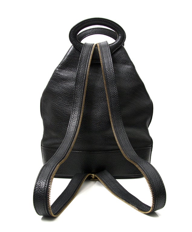 Rare Delvaux backpack in supple wide grained calfskin with gold hardware. Zip the shoulder strap open to wear as a backpack. When unzipped it becomes a shoulder bag.