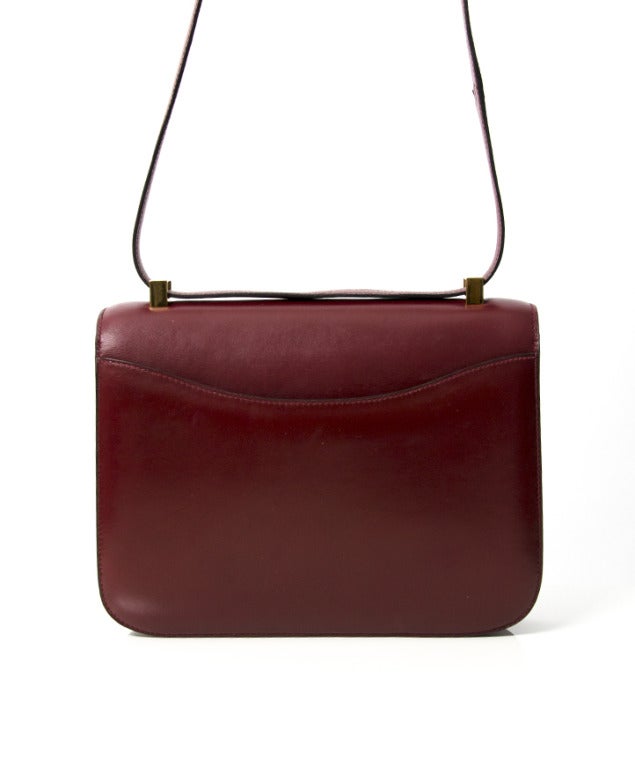 This beautiful Hermes Constance bag is a gorgeous burgundy hue with gold-Tone hardware. 
The adjustable strap allows for the bag to be worn on the wrist or the shoulder. 
This gorgeous bag is so popular & hard to get these days since HERMES