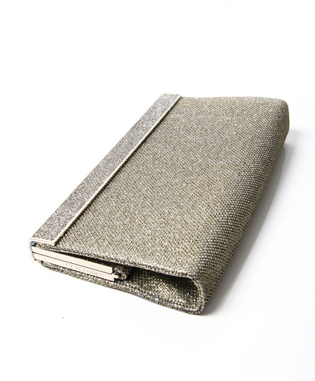 Jimmy choo clutch in sparkling silver. The glitter is really sparkly in real life. 

In very good condition.