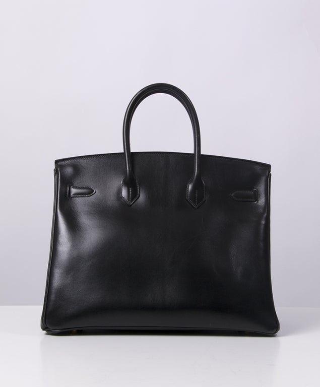Absolutely gorgeous HERMES BIRKIN size 35 in Black with GOLD plated hardware. 
The hardware has very faint hairline scratches. 
The bag is in a very nice condition with very light wear to the bottom corners and some scratches near the leather