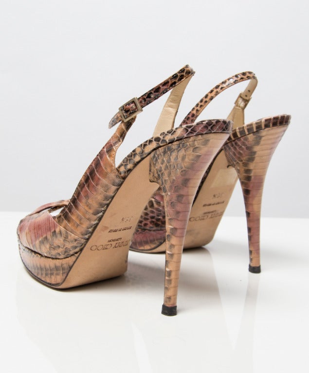 Jimmy Choo snake print peep toe pumps in beige, soft pink and grey. Still in very good condition only from the sole of the shoe you can see that the shoes have been worn. 

Heel measures: 11,5 cm / 4,5