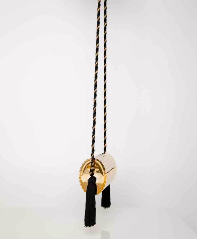 YSL Gold hardware and black tassle clutch/bag at 1stdibs  