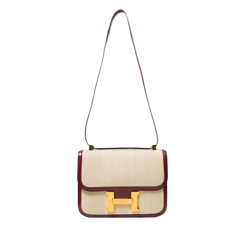 Authentic Hermes Constance H handbag toile canvas leather 23 cm. 
Made of natural box leather and beige canvas (toile), gold hardware.

Dimensions: 23 cm Lenght 18 cm Height 4 cm Depth (9,06 x 7,09 x 1,57 inches)
Shoulder strap: 96 cm long (37,8