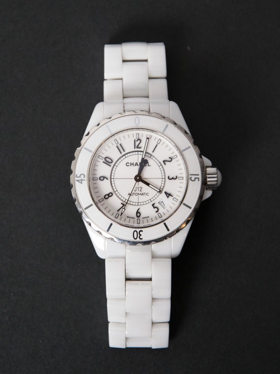 Chanel Lady's White Ceramic J12 Automatic Wristwatch

The J12 series watches are constructed mostly from high-gloss finished Ceramic which is extremely scratch resistant, keeping the watch looking stylish & new for a long time.
All white ceramic