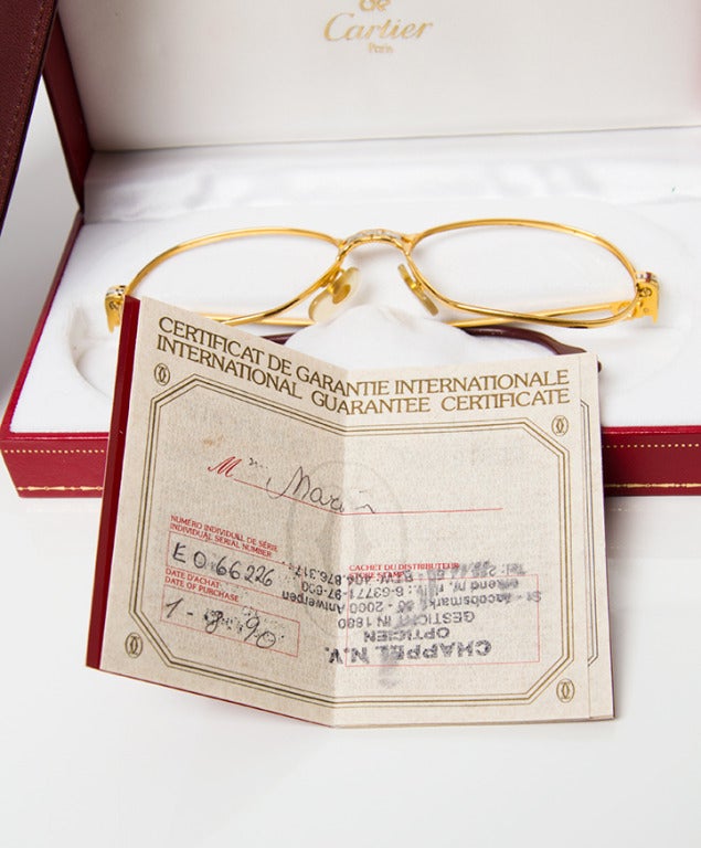 Women's or Men's Cartier gold with silver full frame eyeglasses.