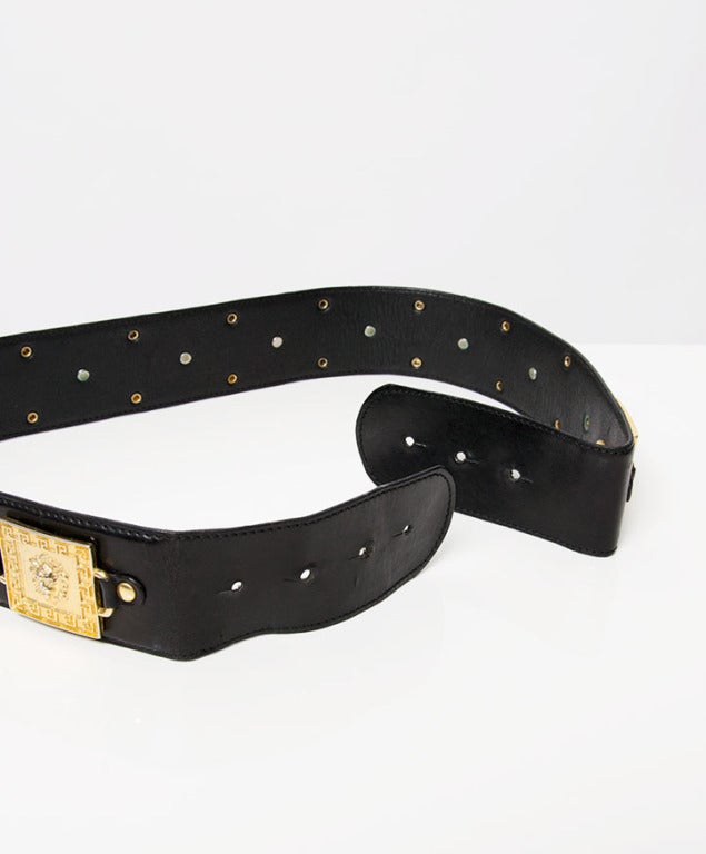 Versace Black leather belt with gold lions and studs.