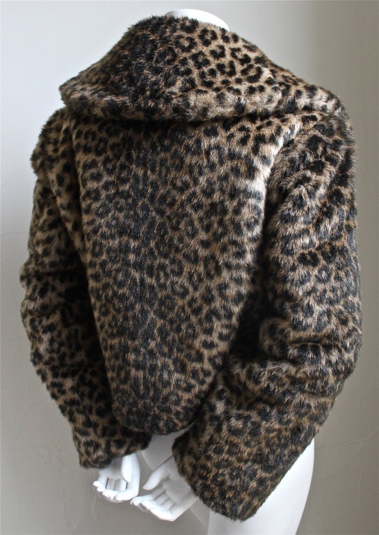 Very rare faux fur bolero jacket with black woven frog closure by Azzedine Alaia dating to the Autumn/Winter collection of 1991-1992. Fits a size small or medium. Hidden metal hook for added closure. Made in France. Excellent condition.