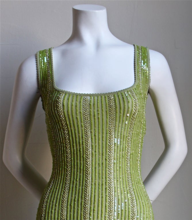Chartreuse green beaded minidress from Azzedine Alaia dating to the early 1990's/ Dress is labeled a size S. Slips on over the head. Made in Italy. Excellent, unworn condition.